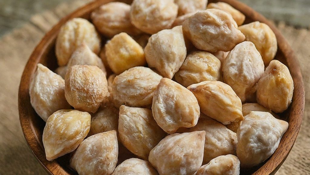 Wide image of Raw candlenuts in their natural form